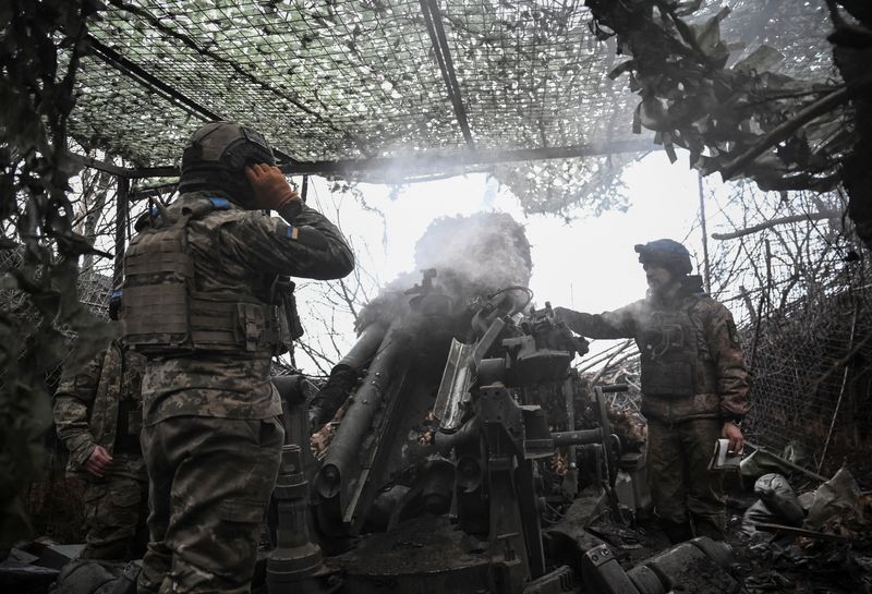Artillerymen of the 44th Separate Artillery Brigade, named after Hetman Danylo Apostol, of the Armed Forces of Ukraine, fire a M777 Howitzer towards Russian troops, amid Russia's attack on Ukraine, in Dnipropetrovsk region, Ukraine December 24, 2025. REUTERS/Stringer