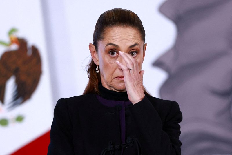 Mexico's President Claudia Sheinbaum reacts during a press conference about the wave of violence in Mexico, following the killing of Mexican drug lord Nemesio Oseguera, known as 'El Mencho', in a military operation on Sunday, at Palacio Nacional, in Mexico City, Mexico, February 23, 2026. REUTERS/Raquel Cunha