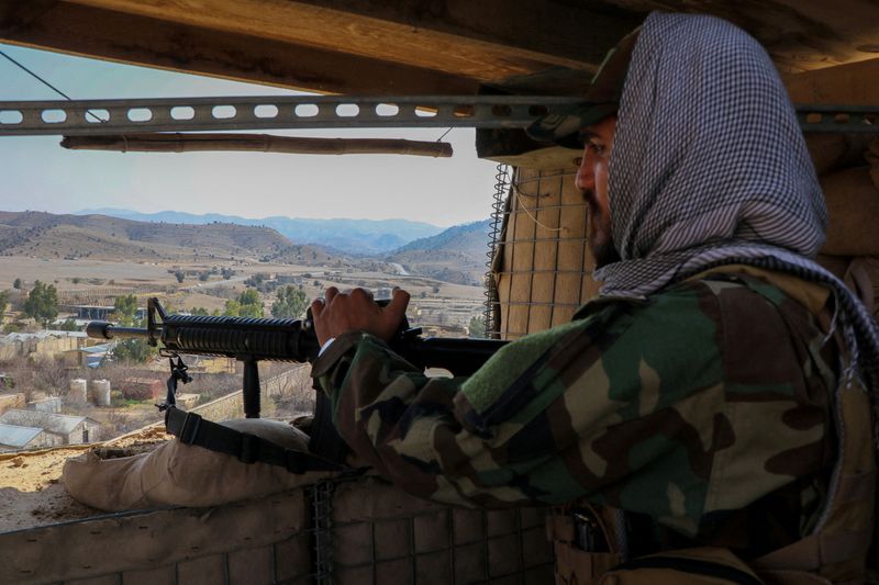 FILE PHOTO: A Taliban soldier keeps vigil from inside his post near the Pakistan-Afghanistan border, in Khost province, Afghanistan, February 27, 2026. REUTERS/Stringer/File Photo