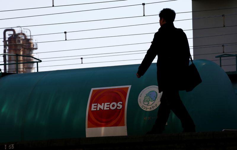 FILE PHOTO: JX Nippon Oil & Energy Corp's Eneos brand logo on a tanker lorry in a train at a station nearby its refinery in Yokohama, Japan February 7, 2017. REUTERS/Kim Kyung-Hoon/File Photo