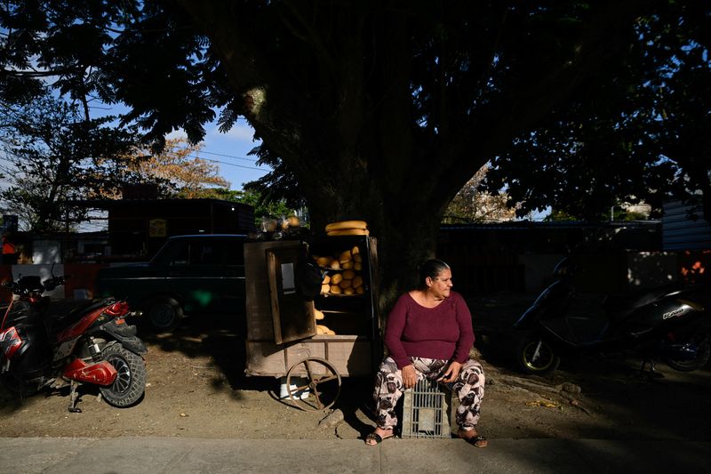 A vendor sits along a street, following an armed incident involving a Florida-registered speedboat and a Cuban patrol, in Santa Clara, Cuba, February 26, 2026. REUTERS/Norlys Perez