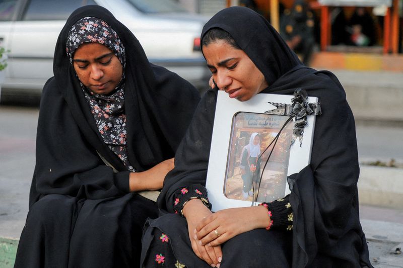 FILE PHOTO: People mourn on the day of the funeral of the victims following a reported strike on a school in Minab, Iran, March 3, 2026. Amirhossein Khorgooei/ISNA/WANA (West Asia News Agency) via REUTERS