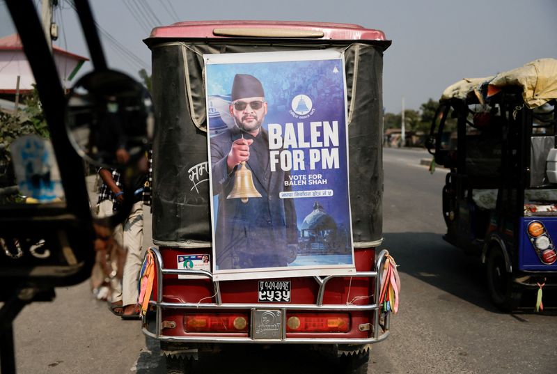 A vehicle with a campaign poster of Balendra Shah, a rapper-turned-politician and the prime ministerial candidate for Rastriya Swatantra Party (RSP), waits for passengers ahead of Nepal's general election, in Gauriganj, Jhapa district, Nepal, February 25, 2026. REUTERS/Navesh Chitrakar