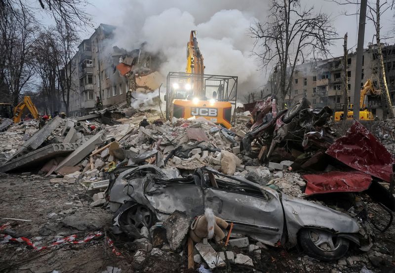 Rescuers work at the site of an apartment building hit by a Russian missile strike, amid Russia's attack on Ukraine, in Kharkiv, Ukraine March 7, 2026.  REUTERS/Vyacheslav Madiyevskyy
