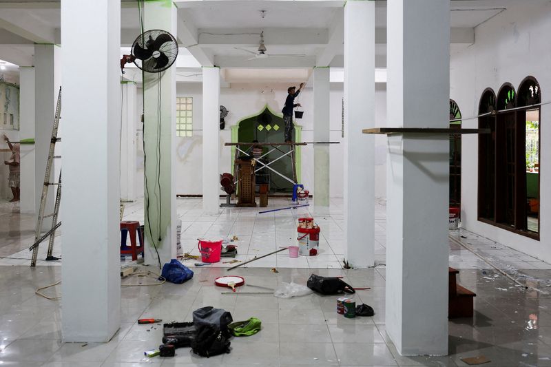 FILE PHOTO: Workers work inside a mosque where explosions occurred the previous day, at a school complex in Jakarta, Indonesia, November 8, 2025. REUTERS/Willy Kurniawan/File Photo