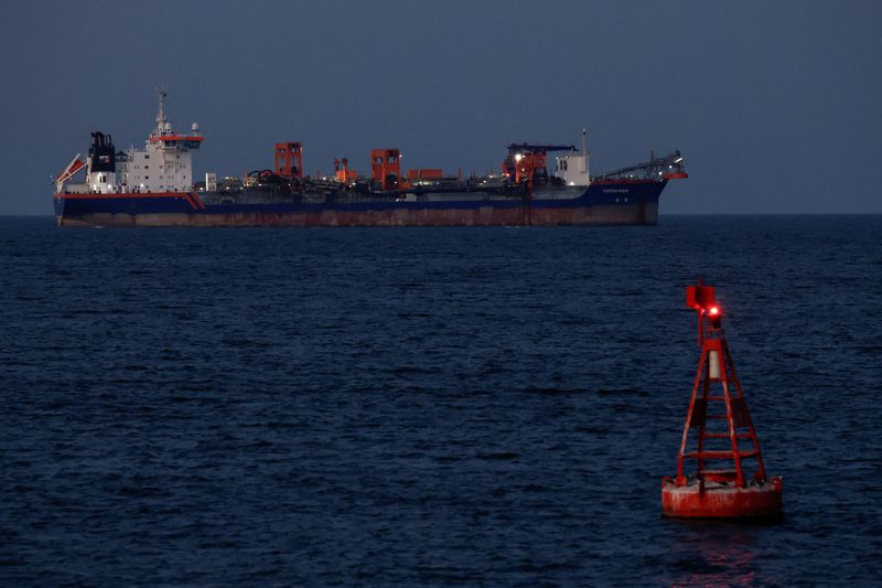 Rotterdam hopper dredger vessel operated by Van Oord sits anchored, as Iran vows to close the Strait of Hormuz, amid the U.S.-Israeli conflict with Iran, in Muscat, Oman, March 9, 2026. REUTERS/Benoit Tessier