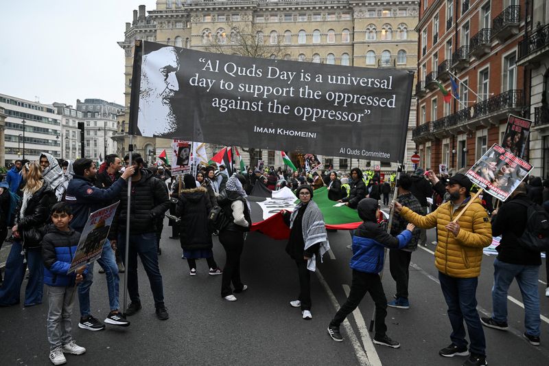 FILE PHOTO: People attend the annual al-Quds Day (Jerusalem Day) rally in support of the Palestinian people, in London, Britain, March 23, 2025. REUTERS/Jaimi Joy/File Photo