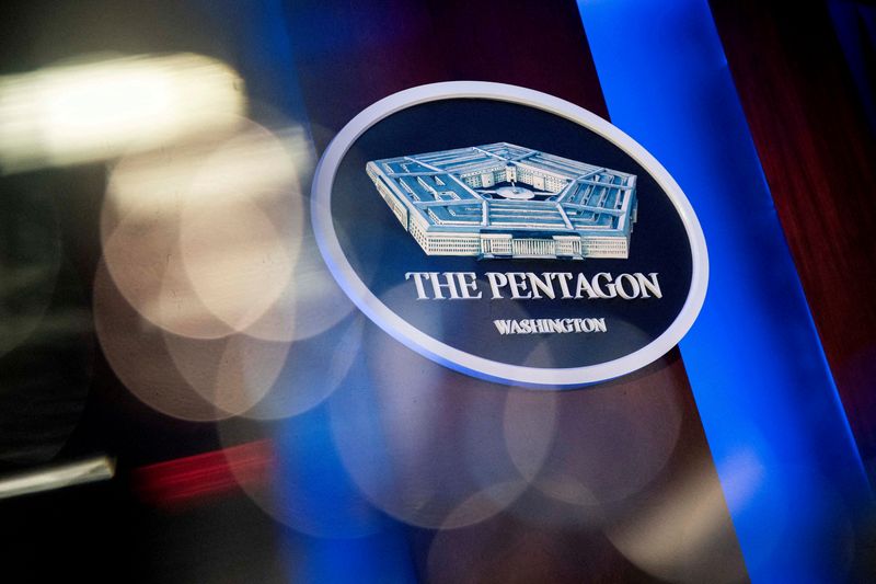 FILE PHOTO: The Pentagon logo is seen behind the podium in the briefing room at the Pentagon in Arlington, Virginia, U.S., January 8, 2020. REUTERS/Al Drago/File Photo