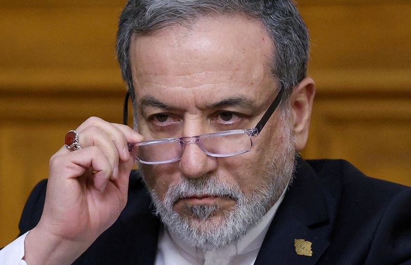 FILE PHOTO: Iranian Foreign Minister Abbas Araqchi adjusts glasses during a press conference in Moscow, Russia, December 17, 2025. REUTERS/Ramil Sitdikov/Pool/File Photo