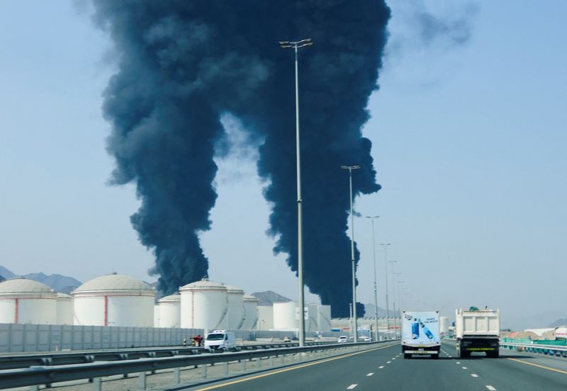 Smoke rises in the Fujairah oil industry zone, caused by debris after interception of a drone by air defenses, according to the Fujairah media office, amid the U.S.-Israel conflict with Iran, in Fujairah, United Arab Emirates, March 14, 2026. REUTERS/Staff