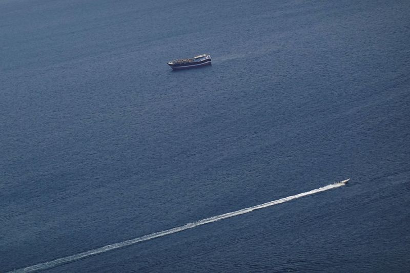 FILE PHOTO: Boats in the Strait of Hormuz amid the U.S.-Israeli conflict with Iran, as seen from Musandam, Oman, March 2, 2026.REUTERS/Amr Alfiky/File Photo