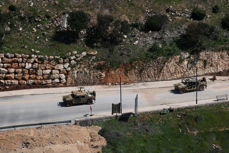 Israeli military vehicles on the Israeli side of the border with Lebanon, amid escalation between Iran-backed Hezbollah and Israel, and amid the U.S.-Israeli conflict with Iran, in northern Israel, March 17, 2026. REUTERS/Ammar Awad