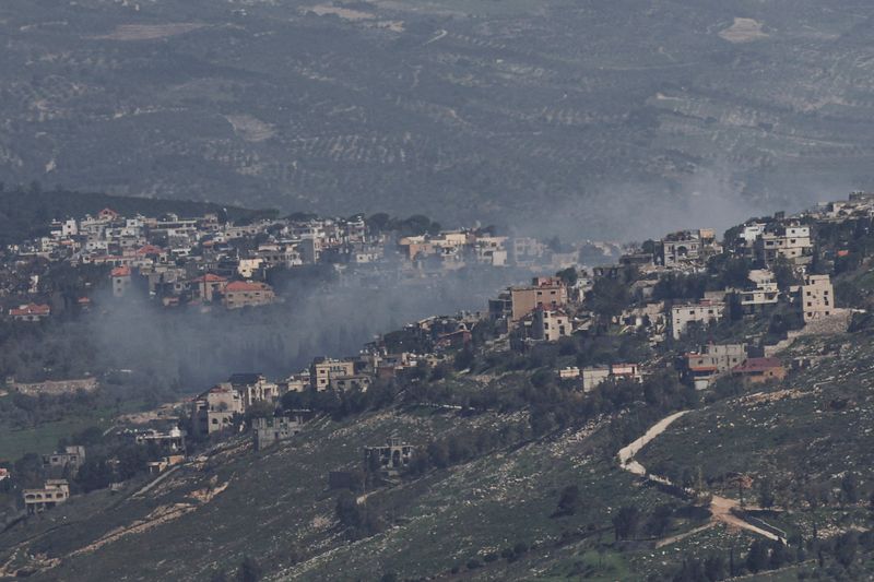Smoke rises from a Lebanese village near the border with Israel, amid escalation between Iran-backed Hezbollah and Israel, and amid the U.S.-Israeli conflict with Iran, as seen from northern Israel, March 19, 2026. REUTERS/Tyrone Siu