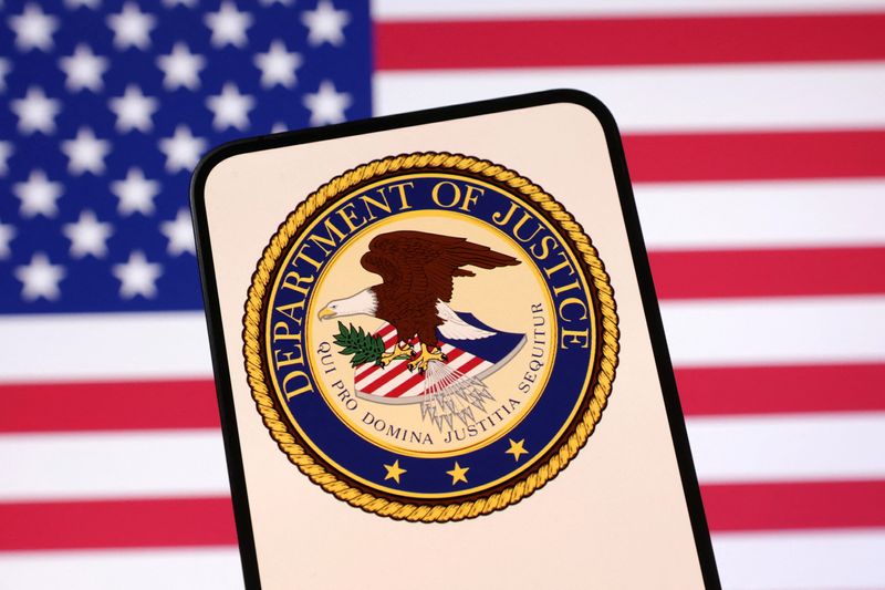 United States Department of Justice logo and U.S. flag are seen in this illustration taken April 23, 2025. REUTERS/Dado Ruvic/Illustration