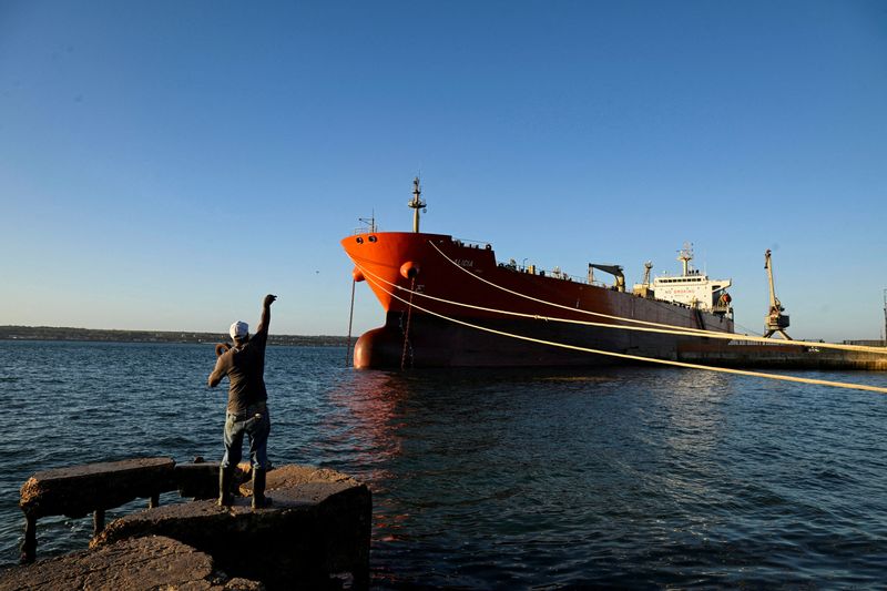 FILE PHOTO: A man fishes near the Cuban-flagged tanker Alicia, docked at the Matanzas terminal, in Matanzas, Cuba, February 10, 2026. REUTERS/Norlys Perez/File Photo