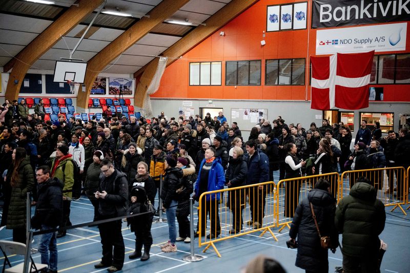 People stand at the polling station at the Godthabhallen, in Nuuk, Greenland, Tuesday, March 24, 2026. Oscar Scott Carl/Ritzau Scanpix/via REUTERS