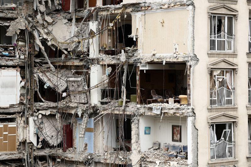 A view of a residential building damaged by a strike, amid the U.S.-Israeli conflict with Iran, in Tehran, Iran, March 23, 2026. Majid Asgaripour/WANA (West Asia News Agency) via REUTERS
