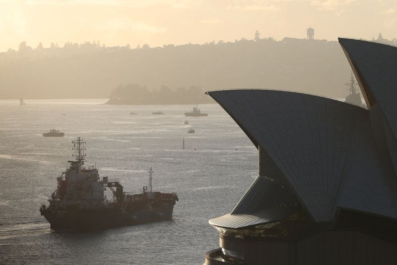 FILE PHOTO: An oil products tanker passes the Sydney Opera House at sunrise in Sydney, Australia, March 21, 2026. REUTERS/Hollie Adams/File Photo