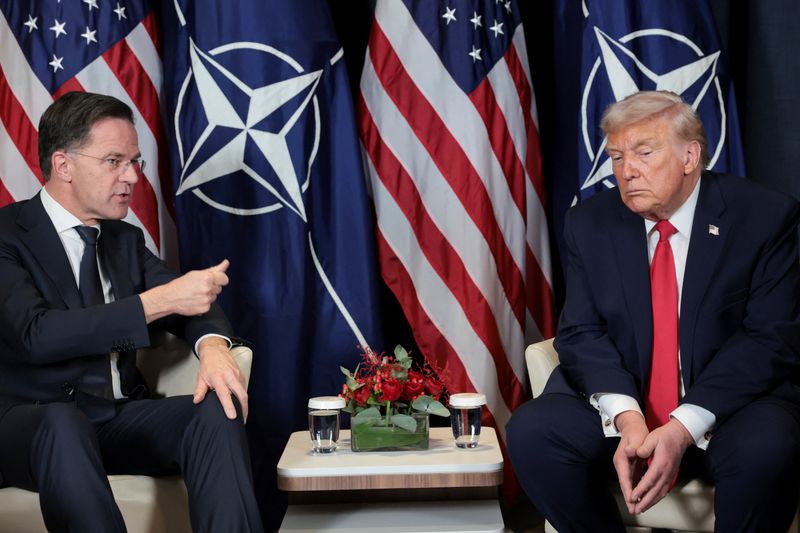 FILE PHOTO: U.S. President Donald Trump holds a bilateral meeting with NATO Secretary General Mark Rutte at the World Economic Forum (WEF) in Davos, Switzerland, January 21, 2026. REUTERS/Jonathan Ernst/File Photo