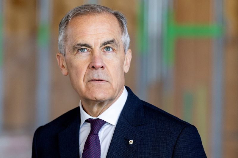 Canada's Prime Minister Mark Carney looks on before making an announcement at the new and currently under construction Embleton Community Centre and Park, in Brampton, Ontario, Canada, April 7, 2026. REUTERS/Carlos Osorio