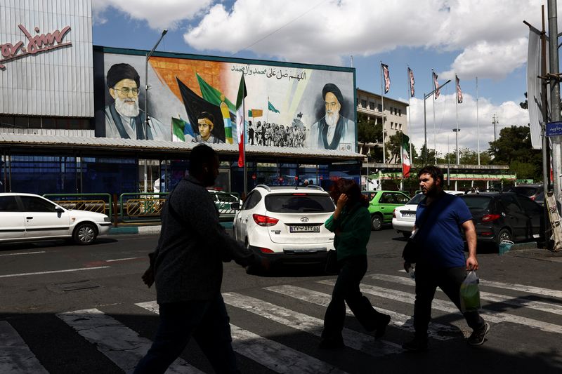 People walk on a street after U.S. President Donald Trump said that he had agreed to a two-week ceasefire with Iran, in Tehran, Iran, April 8, 2026. Majid Asgaripour/WANA (West Asia News Agency) via REUTERS