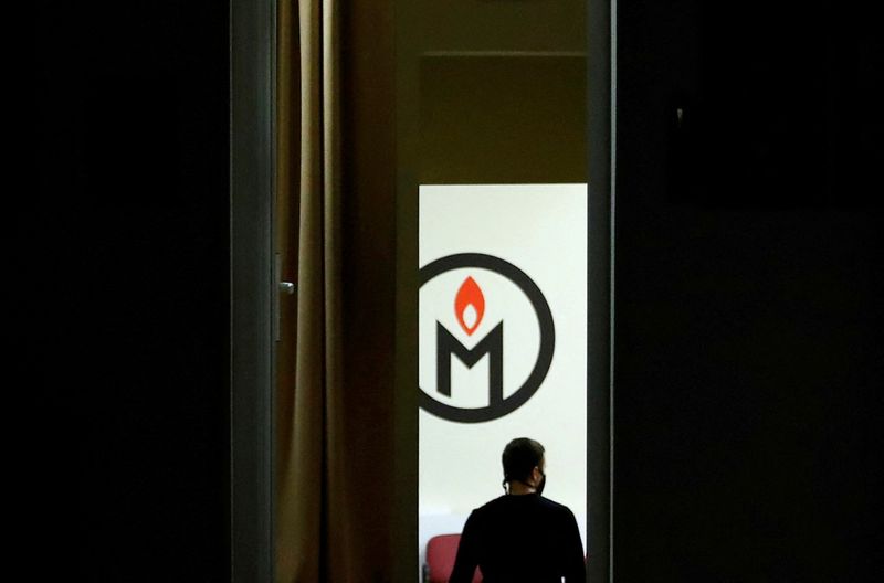 FILE PHOTO: A man walks inside an office of the human rights group Memorial in Moscow, Russia December 29, 2021. Picture taken December 29, 2021. REUTERS/Evgenia Novozhenina/File Photo