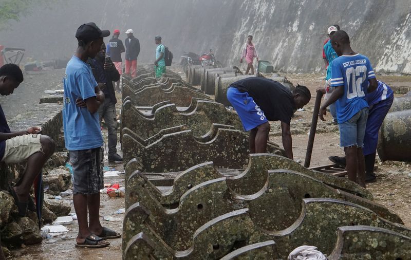 People help to make stretchers to transport the bodies of victims after Haiti's Civil Protection for the Nord Department said a stampede killed several people at the Laferriere Citadel, an early-19th-century fortress packed with students and visitors for an annual celebration of the UNESCO World Heritage site, in Milot, Haiti, April 12, 2026. REUTERS/Richardson Ulysse