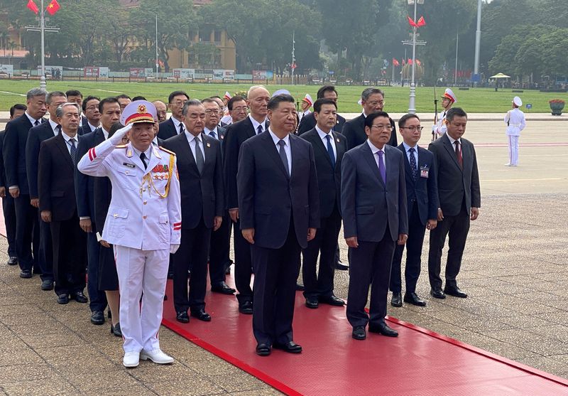 FILE PHOTO: Chinese President Xi Jinping attends a lay wreath ceremony at the Ho Chi Minh mausoleum during a two day state visit to Hanoi, Vietnam, December 13, 2023. REUTERS/Thinh Nguyen/File Photo