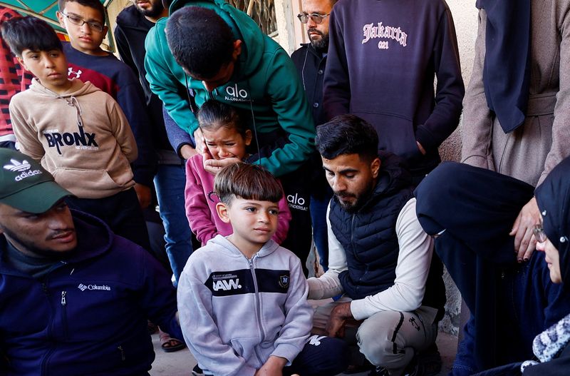 Mourners react during the funeral of Palestinians who were killed in an Israeli strike, according to medics, at Al-Aqsa Martyrs Hospital in Deir al-Balah, central Gaza Strip, April 13, 2026. REUTERS/Mahmoud Issa