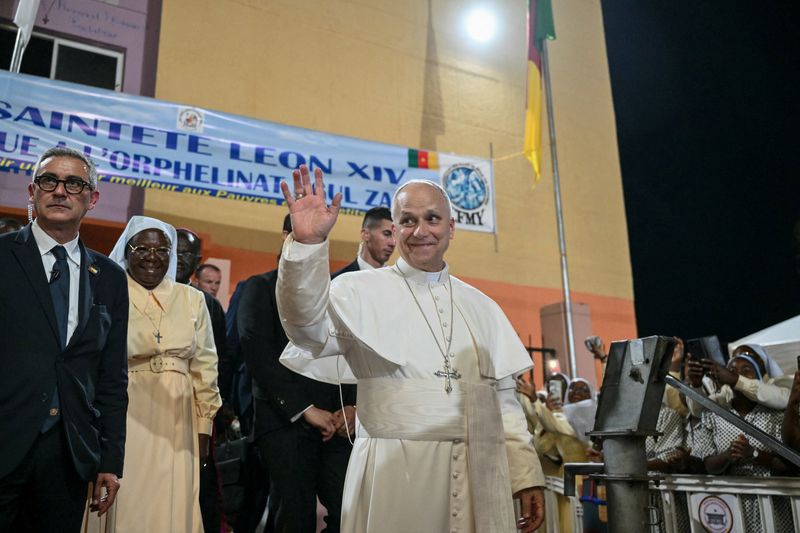 Pope Leo XIV waves to supporters as he leaves after his visit to the Ngul Zamba (Power of God) orphanage in Yaounde, Cameroon, during an apostolic journey to Africa, on April 15, 2026.     ALBERTO PIZZOLI/Pool via REUTERS