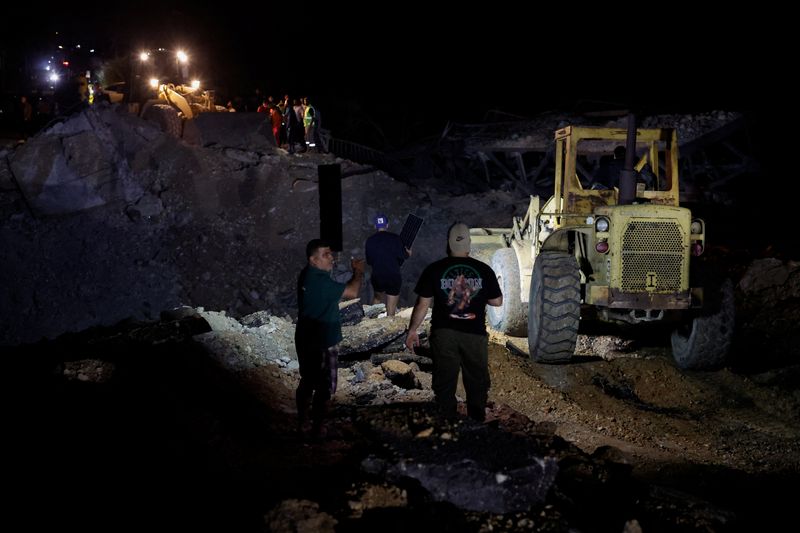 People work to repair the bridge linking southern Lebanon to the rest of the country, which was hit earlier in an Israeli strike, after a 10-day ceasefire between Lebanon and Israel went into effect, in Qasmiyeh, Lebanon, April 17, 2026. REUTERS/Louisa Gouliamaki     TPX IMAGES OF THE DAY