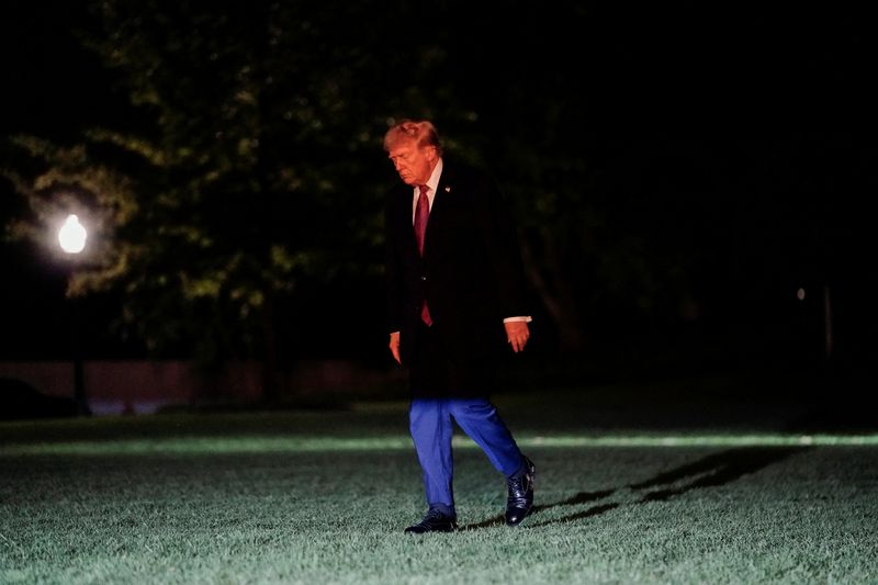 U.S. President Donald Trump walks after exiting Marine One on the South Lawn while returning to the White House in Washington, D.C., U.S., April 17, 2026. REUTERS/Nathan Howard