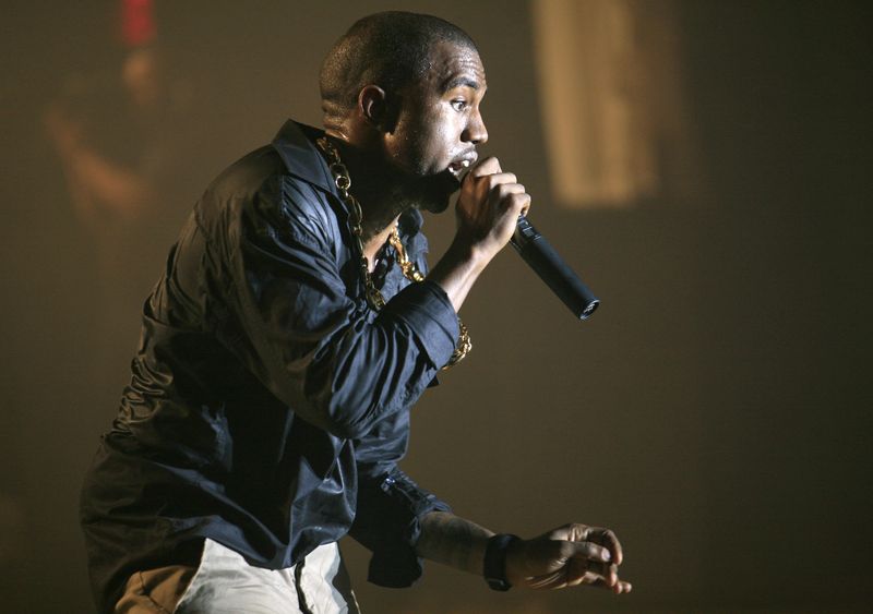 Music artist Kanye West performs during a private concert at the Nokia Theatre in New York City August 29, 2006. REUTERS/Eric Thayer/File Photo