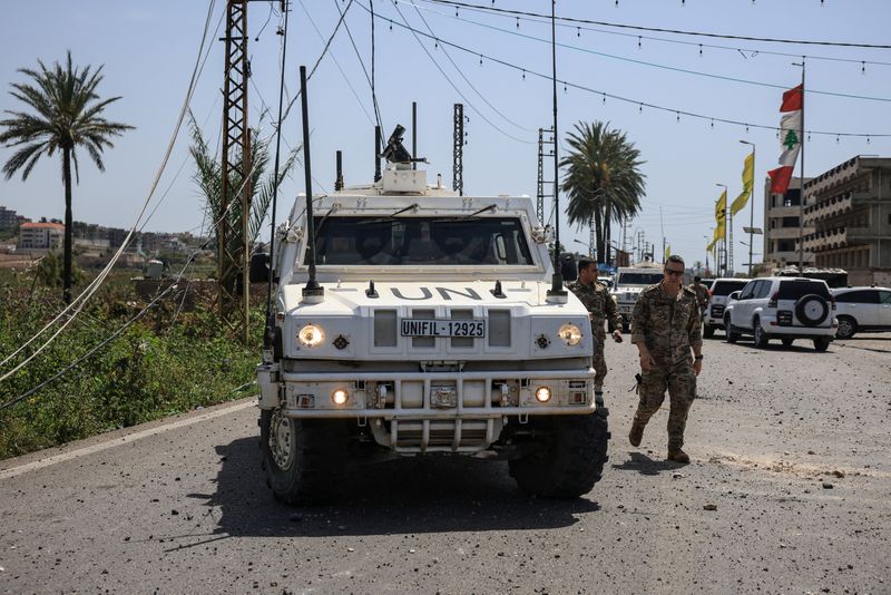 United Nations Interim Force in Lebanon (UNIFIL) peacekeepers and members of the Lebanese army arrive at the site, after an Israeli strike severed the last remaining bridge linking southern Lebanon to the rest of the country, in Qasmiyeh, Lebanon April 16, 2026. REUTERS/Louisa Gouliamaki