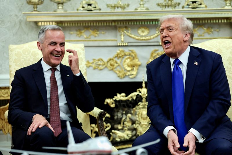 U.S. President Donald Trump and Canada's Prime Minister Mark Carney react as they meet in the Oval Office at the White House in Washington, D.C., U.S., October 7, 2025. REUTERS/Evelyn Hockstein