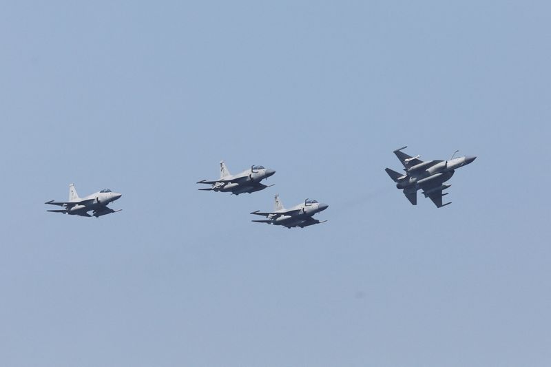 FILE PHOTO: Pakistan Air Force's JF-17 Thunder jets fly past during the sea phase of Pakistan Navy's Multinational Exercise AMAN-23, in the North Arabian Sea near Karachi, Pakistan, February 13, 2023. REUTERS/Akhtar Soomro/File Photo