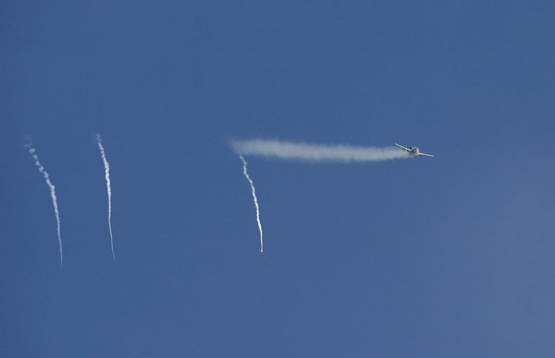 U.S. air force fighter plane A-10 "Warthog" fires shells towards insurgents, as seen from the Combat Outpost Cahill, a small U.S. military camp southeast of Baghdad, November 6, 2007. REUTERS/Erik de Castro/File Photo