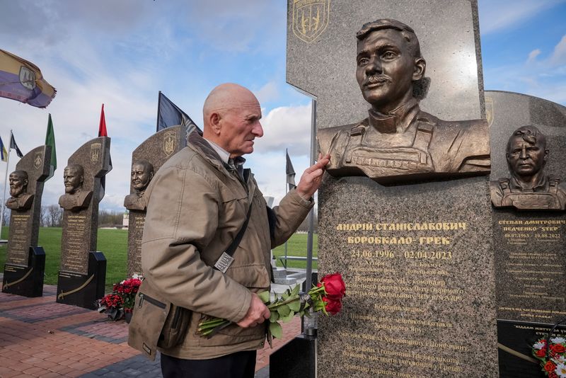 Petro Hurin, 76, one of hundreds of thousands of ‘liquidators’ brought to clean up the aftermath of the explosion that tore apart reactor Four of the Chornobyl nuclear plant in Ukraine on April 26, 1986, visits a monument dedicated to his grandson Andrii, a Ukrainian serviceman killed at the age of 26 while fighting near Bakhmut in Ukraine’s eastern Donetsk region in 2023, at a memorial in Cherkasy region, Ukraine April 7, 2026. REUTERS/Anna Voitenko