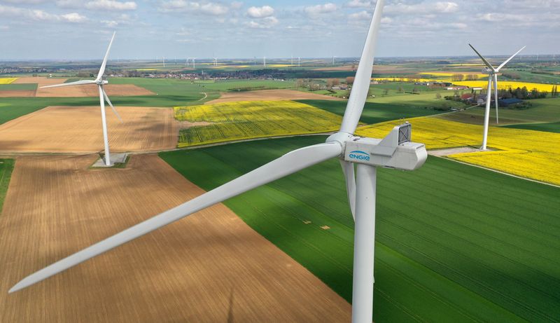 An aerial view shows Engie Green power-generating windmill turbines amid rapeseed and wheat fields in Saint-Hilaire-lez-Cambrai, France, April 26, 2023. REUTERS/Pascal Rossignol/File Photo