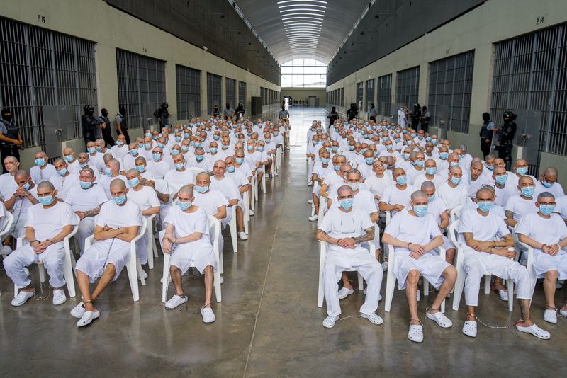 Members of Mara Salvatrucha, also known as MS-13 gang, attend an open hearing by El Salvador prosecutors against 486 members of the gang, who are accused of more than 47,000 crimes committed between 2012 and 2022, according to a statement from the Attorney General's Office, at the Terrorism Confinement Center (CECOT) in Tecoluca, El Salvador, April 20, 2026. Attorney General's Office of El Salvador/Handout via REUTERS