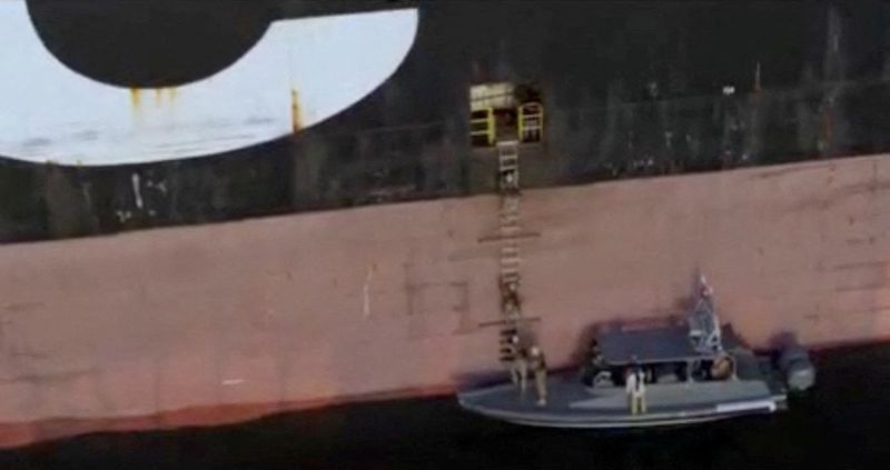 A screen capture from a video said to show the seizure of the container ships MSC Francesca and Epaminondas in the Strait of Hormuz, broadcasted on Iranian State TV, and released April 22, 2026, shows soldiers taking part in the operation. IRIB/Handout via REUTERS