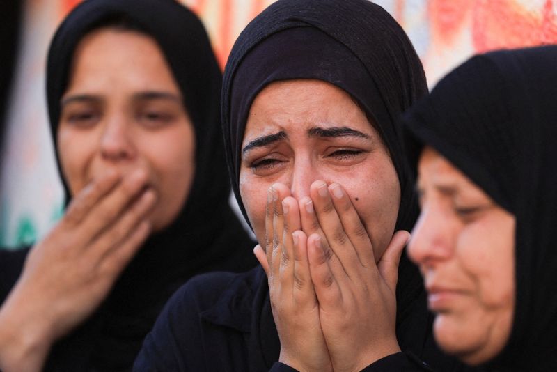 Women mourn during the funeral of Palestinians, who were killed in an Israeli strike, according to medics, at Al-Shifa Hospital in Gaza City, April 23, 2026. REUTERS/Dawoud Abu Alkas