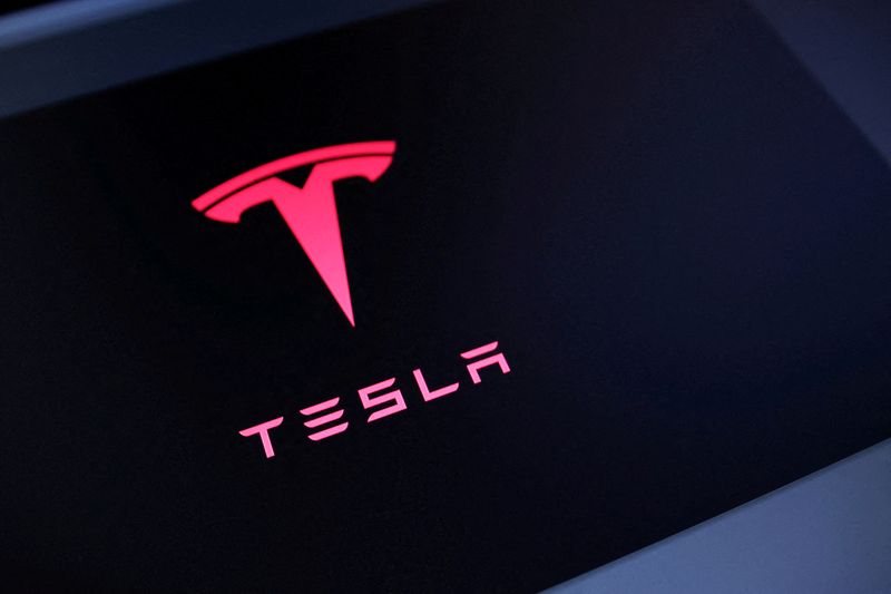 FILE PHOTO: Tesla's logo is seen in this illustration created on July 23, 2025. REUTERS/Dado Ruvic/Illustration/File Photo