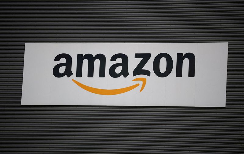 FILE PHOTO: Amazon logo outside an Amazon warehouse in Manchester, Britain, October 28, 2025. REUTERS/Phil Noble/File Photo