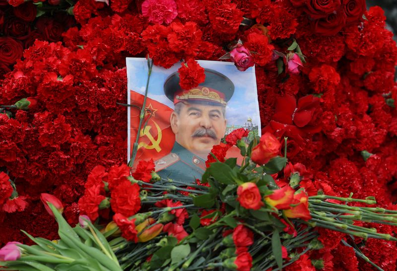 A portrait of Soviet leader Josef Stalin and flowers are placed on his grave during a ceremony marking the 70th anniversary of Stalin's death, in Red Square in Moscow, Russia March 5, 2023. REUTERS/Evgenia Novozhenina