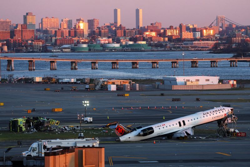 FILE PHOTO: The wreckage of an Air Canada Express jet that collided with a ground vehicle on Monday at New York's LaGuardia Airport in Queens, New York, U.S., March 24, 2026. REUTERS/Shannon Stapleton/File Photo