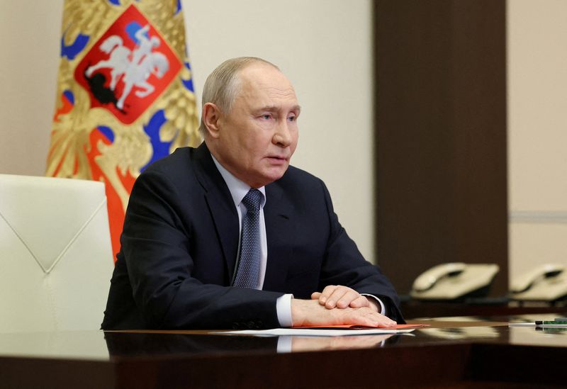 FILE PHOTO: Russian President Vladimir Putin chairs a meeting with members of the Security Council via a video link at the Novo-Ogaryovo state residence outside Moscow, Russia, April 17, 2026. Sputnik/Pool via REUTERS/File Photo