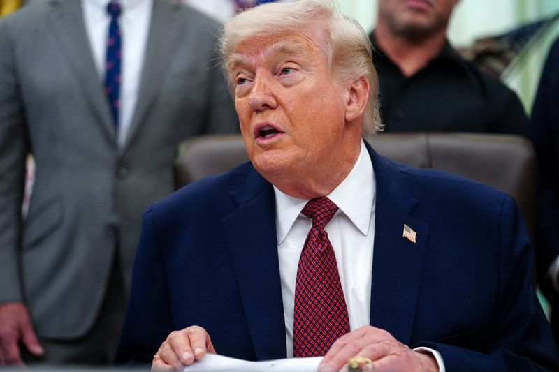 FILE PHOTO: U.S. President Donald Trump speaks about research into mental health treatments in the Oval Office of the White House in Washington, D.C., April 18, 2026. REUTERS/Nathan Howard/File photo