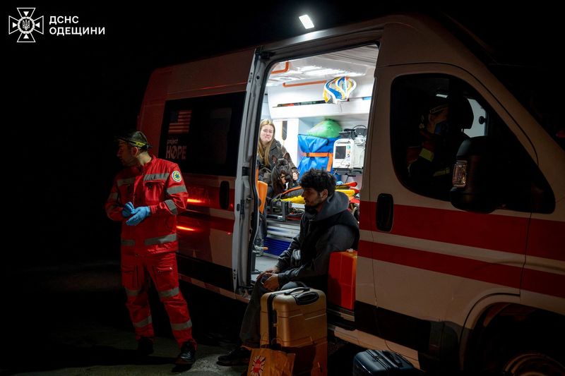 Residents sit in an ambulance at a site of a Russian drone strike, amid Russia's attack on Ukraine, in Odesa, Ukraine in this handout picture released April 27, 2026. Press service of the State Emergency Service of Ukraine in Odesa region/Handout via REUTERS