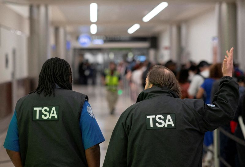 Transportation Security Administration (TSA) officers walk through the domestic terminal at Hartsfield-Jackson Atlanta International Airport in Atlanta, Georgia, U.S. March 27, 2026. REUTERS/Alyssa Pointer